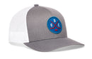 Haka Hat Quebec Hockey Trucker Hat | QBC X Snapback in grey and white mesh, featuring a round blue patch with two crossed red hockey sticks and the letters Q, B, and C in white.