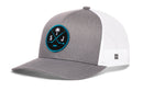 Gray and white Haka Hat San Jose Hockey Trucker Hat featuring a round patch with a palm tree, crossed hockey sticks, a puck, and the letters S and J.