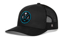 Black Haka Hat San Jose Hockey Trucker Hat | SJ X snapback with a mesh back and a round patch featuring crossed hockey sticks, a palm tree, a puck, and the letters S and J in teal and white.
