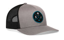 Grey and black Haka Hat San Jose Hockey Trucker Hat featuring a circular patch with crossed hockey sticks, a palm tree, and the letters S and J.