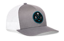 Haka Hat San Jose Hockey Trucker Hat | SJ X Snapback in gray and white, featuring a round patch with a palm tree, crossed hockey sticks, a puck, and the letters S and J.