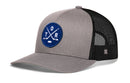 Show your Toronto hockey pride with the Haka Hat Toronto Hockey Trucker Hat | TOR X Snapback. This stylish gray and black mesh snapback trucker hat features a premium embroidered blue circular patch with crossed hockey sticks, a puck, and the letters T O R—making it the perfect choice for any fan of Toronto hockey and classic trucker style.