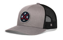 Grey and black Haka Hat Winnipeg Hockey Trucker Hat featuring a circular patch with the letters WPG and crossed hockey sticks.