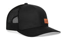 The Haka Hat LFG Trucker Hat is a black snapback with mesh back, curved brim, orange Lets Go patch on the front, and a comfort-fit sweatband for all-day wear.