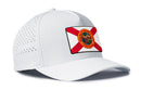 The Haka Hat Florida Flag Performance 5-Panel Hat is a white Flexfit® Snapback with a state flag patch, perforated sides, water-repellent design, and added comfort from the Flexfit sweatband.