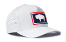 The Haka Hat Wyoming Flag Performance 5-Panel Hat features a Flexfit sweatband, perforated crown, and a patch with a white bison on a navy background outlined in red. This WY Buffalo Flexfit® Snapback blends comfort and state pride.