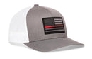 The Haka Hat Thin Red Line Trucker Hat is a gray and white snapback with a mesh back, featuring a black and gray American flag fire tactical patch with a red stripe on the front.