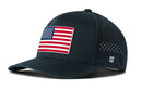 The Haka Hat USA Performance 5-Panel Hat is a dark blue American Flag Flexfit® Snapback with an embroidered patch, perforated sides, and water-repellent fabric for durability.