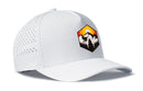 The Haka Hat Hexagon Mountain Trees Performance 5-Panel Hat by Haka Hat is a white outdoors Flexfit snapback featuring a vibrant patch with mountains, trees, and a sunset. Small ventilation holes on the sides enhance breathability, making this cap perfect for outdoor activities. The hat is displayed angled to the left on a plain white background.