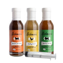 The Hickman's BBQ Marinade Package with Injector by Hickman's BBQ includes three bottles—Bovine Bonanza, Party Fowl, and Divine Swine—along with a convenient plastic marinade injector in front, making it the ultimate BBQ marinade kit.