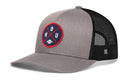 The Haka Hat Houston Trucker Hat | Black HOU X Football Snapback by Haka Hat features a gray and black mesh design with a round blue and red HOU patch on the front, accented by a small football icon in the center—making it the perfect go-to hat for Texas game days.