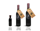 Three bottles of Georgetown Olive Oil Co. Huckleberry Balsamic Vinegar in 60ml, 200ml, and 375ml sizes are displayed left to right on a white background. The two larger bottles feature huckleberry-themed tags, highlighting the rich, distinctive flavors characteristic of aged balsamic vinegar by Georgetown Olive Oil Co.