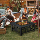 Four friends gather in a cozy backyard around the DirectDeals 32 Inch 3 in 1 Outdoor Square Fire Pit Table with BBQ Grill and Rain Cover for Camping, grilling skewers under string lights with wood stacked nearby.
