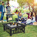 A group of friends enjoys a picnic with drinks, a hammock, and the DirectDeals 32 Inch 3 in 1 Outdoor Square Fire Pit Table with BBQ Grill and Rain Cover for Camping. Colorful pennant banners hang in the background.