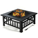 A 32 Inch 3 in 1 Outdoor Square Fire Pit Table with BBQ Grill and Rain Cover for Camping by DirectDeals sits on a white background, flames inside, mesh cover on top, and fire poker placed beside it.