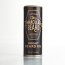 A cylindrical tin featuring gold text on a black background labeled “Conditioning Natural Beard Oil | The Immaculate Beard” by The Immaculate Beard, described as a premium gentlemen’s grooming supply and effective beard conditioner, 1 oz (28g).