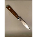 The Spaceman Knives Interstellar Utility Knife by Spaceman Knives features a wooden handle with metal rivets and a Damascus-patterned blade, reflecting expert craftsmanship, shown resting on a light surface.