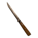 The Spaceman Knives Interstellar Boning Knife by Spaceman Knives features a patterned Damascus blade and wooden handle, appearing to float before a vivid galaxy background—ideal for precision trimming.