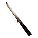 The Spaceman Knives Interstellar Boning Knife features a patterned Damascus steel blade and sleek black handle, floating before a vibrant galaxy—precision trimming from Spaceman Knives that's truly out of this world.