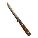 The Spaceman Knives Interstellar Boning Knife, featuring a textured Damascus steel blade and wooden handle, rests on a light surface beside a white ruler marked 7–10—ideal for precise trimming.