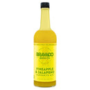 A bottle of Bravado Spice Co Pineapple & Jalapeño Margarita Mixer, an artisan craft margarita mixer from Bravado Spice Co, featuring a yellow label with green text and product details, and topped with a black cap.