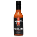 A 5 fl oz (148 ml) bottle of Bravado Spice Co Garlic & Árbol Moruga Scorpion Hot Sauce by Bravado Spice Co, labeled Super Hot, featuring a sleek black label with a bold red graphic. This ultra-hot sauce is made with fiery Trinidad Moruga Scorpion peppers.