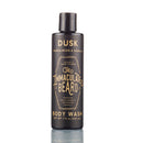 A 7.5 oz black bottle of The Immaculate Beard Body Wash, featuring gold lettering and an elegant design, stands upright on a white background. This paraben-free formula by The Immaculate Beard offers a luxurious cleansing experience with a subtle Dusk Sandalwood & Vanilla fragrance.