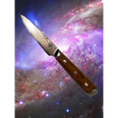 The Spaceman Knives Interstellar Utility Knife, featuring a patterned blade and wooden handle, floats against a vibrant, swirling galaxy backdrop in outer space.