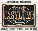 The Lone Star Art "Insane Asylum - Metal Sign" features black and beige vintage style, reads INSANE ASYLUM ENTRANCE, and is printed on rustproof aluminium—perfectly funny as a Halloween indoor or outdoor decoration.