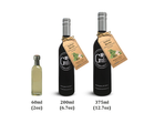 Three bottles of Georgetown Olive Oil Co. Italian Herbs White Balsamic in 60ml, 200ml, and 375ml sizes are displayed against a white background. The two larger bottles feature black labels and tags that read "Italian Herbs," showcasing flavors inspired by Modena, Italy from Georgetown Olive Oil Co.