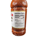 A close-up of a Jack Mixon's Old South Bar-B-Que Sauce bottle by Myron Mixon displays nutrition facts: 30 calories, 0g fat, 290mg sodium, 6g carbs, 4g sugars, and 0g protein per 2-tbsp serving, with the brown vinegar-based sauce visible inside.