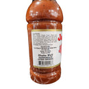 A close-up of a Jack Mixon's Old South Bar-B-Que Sauce bottle by Myron Mixon shows its ingredient list, producer info, barcode, and "shake well & refrigerate after opening" directions. The reddish-brown sauce is packed with visible spices.