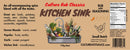 A food label for Culture Hot Sauce Kitchen Sink Rub, an all-in-one spice blend and BBQ seasoning from Culture Hot Sauce, featuring a kitchen sink filled with assorted utensils and vegetables. The label displays ingredients, suggested uses, nutrition facts, and branding information.