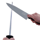 Using the SpitJack 8 Inch Chef Knife and the 11 Inch Sharpening Hone from SpitJack, a person sharpens the knife by holding the honing rod vertically and drawing the blade down along its side.