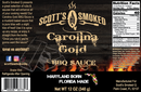 Label for Scott’s Smoked Q Carolina Gold Mustard BBQ Sauce for Pork, Chicken and Burgers, by Scott’s Smoked Q, featuring wood textures, a gold pig illustration, nutrition facts, and social media details. The label highlights this sauce’s tangy Southern flavor and celebrates its unique mustard-based barbecue heritage inspired by traditions from Maryland to Florida. Net weight: 12 oz.