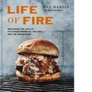 The cover of Life of Fire: Mastering the Arts of Pit-Cooked Barbecue, the Grill, and the Smokehouse: A Cookbook – Hardcover from Books by splitShops features a barbecue sandwich topped with coleslaw on a grill, with the title and authors’ names, Pat Martin and Nick Fauchald, displayed above the image.