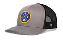 Introducing the Haka Hat Los Angeles Trucker Hat | Black LA X Football Snapback by Haka Hat. This stylish snapback features a gray and black design with a round patch on the front that displays a palm tree, the letters L and A, and a football. The back includes breathable black mesh material, making it the perfect accessory for any football fan.