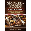 The cover of The Smoked-Foods Cookbook: How to Flavor, Cure, and Prepare Savory Meats, Game, Fish, Nuts, and Cheese - Paperback shows a metal tray filled with homemade smoked meats and a side of coleslaw on a wooden table.