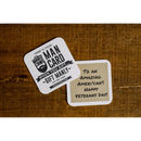 DDR BBQ Supply Manly Cans gift card with a handwritten Veterans Day message on a rustic wooden surface