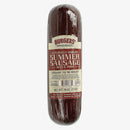 The Manly Cans CANivore Meat Gift Can by Manly Cans features a sealed, cylindrical package of beef and pork sausage (16 oz) with a beige label and red lettering—perfect as a tasty meat gift.