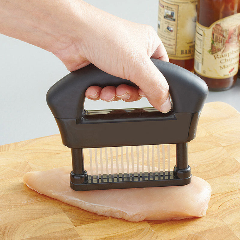 Meat Tenderizer for tenderizing and marinading meat in use on chicken