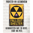 The Fallout Shelter - Metal Sign by Lone Star Art, in yellow and black with a radiation symbol, is printed on rust-proof aluminum—ideal man cave decor or a unique Father's Day gift.