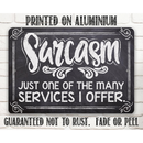 The Sarcasm Just One Of The Many - Metal Sign by Lone Star Art is a humorous chalkboard-style aluminium wall decor that won't rust, fade, or peel—perfect as a funny office gift.