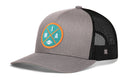 Show your Miami pride on game day with the Haka Hat Miami Trucker Hat—a black snapback cap featuring a mesh back and a vibrant round patch on the front with “MIA” and a small football graphic.