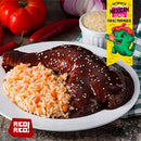 A plate of Mexican mole chicken, garnished with sesame seeds and served alongside a portion of rice with vegetables, is shown with fresh vegetables and a checkered napkin in the background. A label reads "Authentic Mexican Flavor," emphasizing the rich, traditional taste of Mexican cuisine brought to life by classic spices such as Rico Rico Chile Powder 3 Pack Bundle—featuring Ancho, Guajillo, and Arbol varieties.