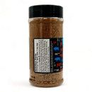 A clear plastic jar with a black lid, filled with brown Myron Mixon Steak Seasoning. The label features nutrition facts and ingredients in black on white, plus colorful graphics on the right. Brand: Myron Mixon.