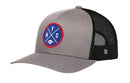 Introducing the Haka Hat New York Trucker Hat—a black mesh snapback by Haka Hat featuring a round blue and red embroidered NYC X patch with crossed lines and a small football on the front, making it the perfect football hat for any fan of the city.