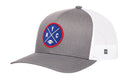 Introducing the Haka Hat New York Trucker Hat | Black NYC X Football Snapback by Haka Hat—a stylish trucker hat featuring a blue and red circular NYC X embroidered patch on the front. Designed with a curved brim and white mesh back, it perfectly blends classic appeal with a touch of city pride.