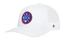The Haka Hat New York Trucker Hat features a white mesh design with a blue and red embroidered NYC X patch on the front, plus a small black-and-white tag on the side.