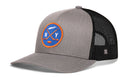Grey and black Haka Hat New York Hockey Trucker Hat featuring an embroidered patch with two crossed hockey sticks, a puck, and the letters NY in an orange-bordered blue circle.